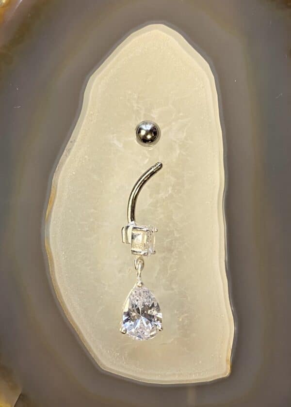 Banane nombril diams et pendentif pierre blanche