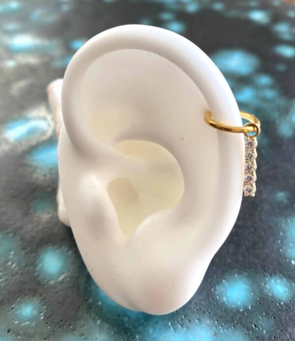 Anneau en acier plaqué or avec un pendentif 5 diams